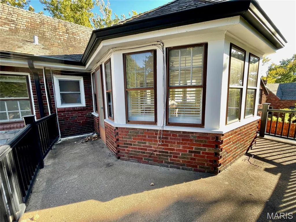 Rear brick sunroom and deck